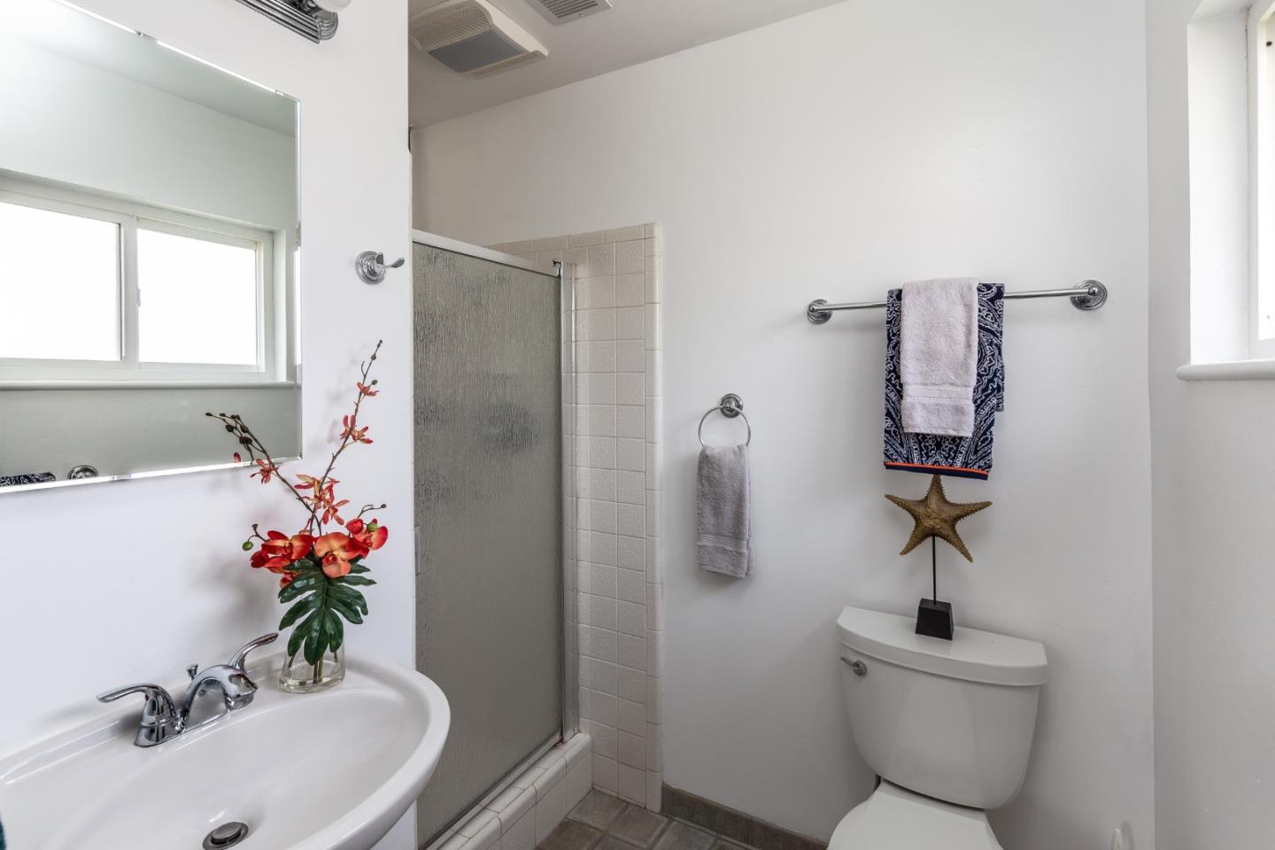 180 Maricopa Drive Los Gatos, CA 95032 - Photo 6 of 14 a bathroom with a sink toilet and a mirror