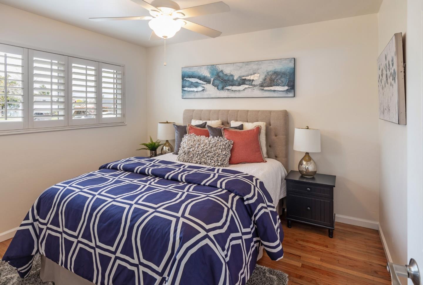 180 Maricopa Drive Los Gatos, CA 95032 - Photo 8 of 14 a bedroom with a bed and wooden floor