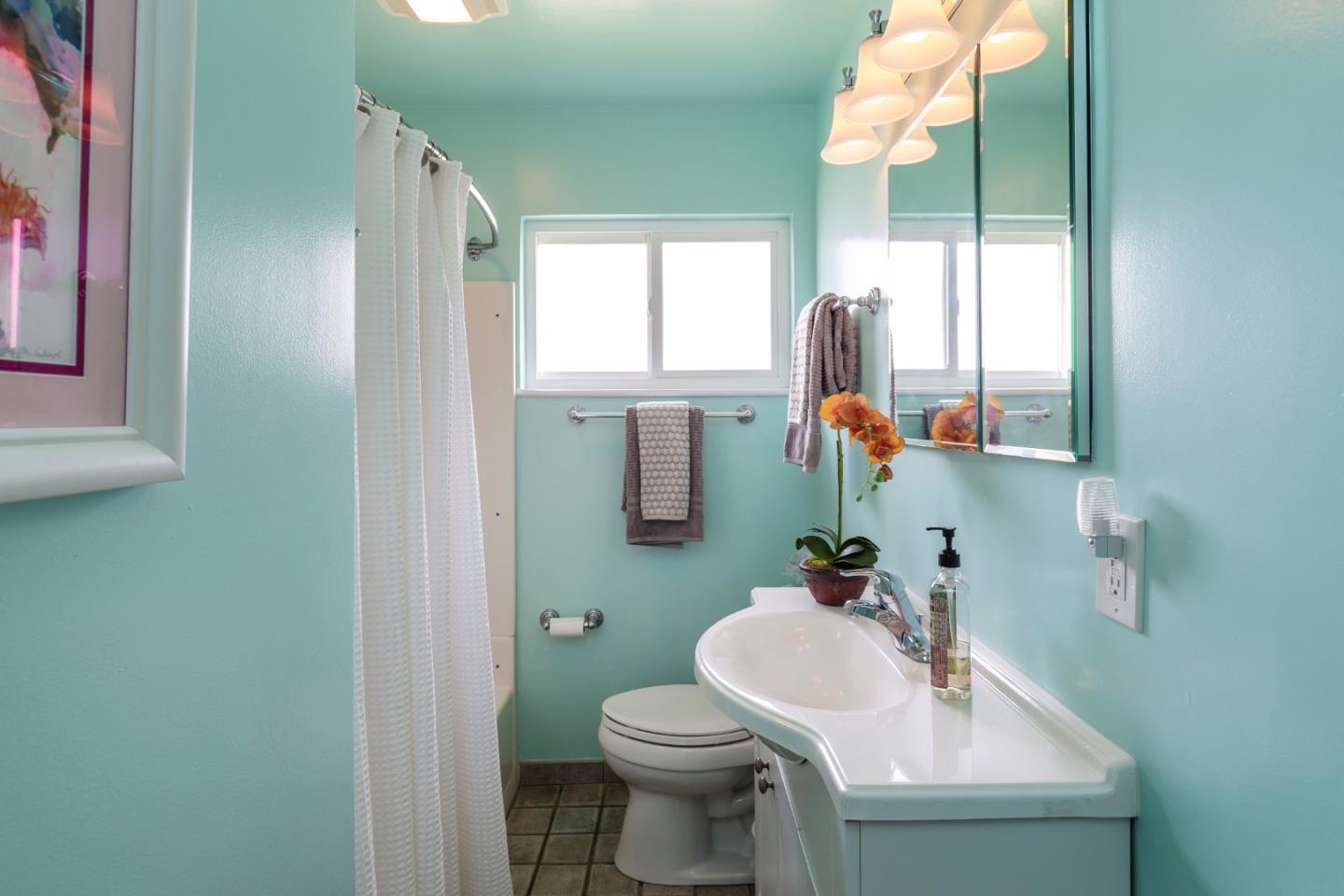 180 Maricopa Drive Los Gatos, CA 95032 - Photo 9 of 14 a bathroom with a sink mirror and toilet