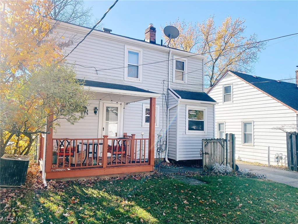 9704 Snow Road Cleveland, OH 44130 - Photo 22 of 24 Rear view of house featuring a lawn and a wooden deck