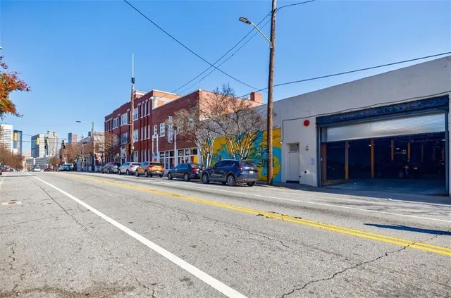 a view of a building with a street