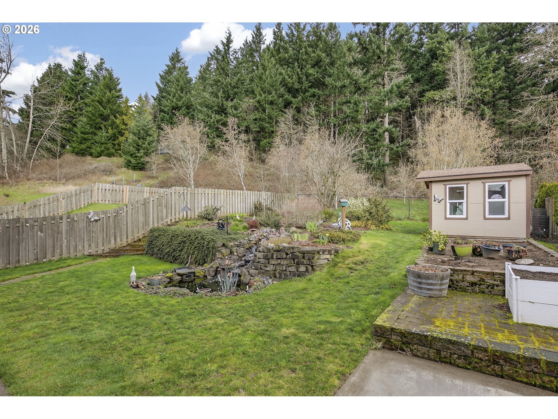 163 Southwest Sandlewood Loop Gresham, OR 97030 - Photo 8 of 47 a backyard of a house with table and chairs