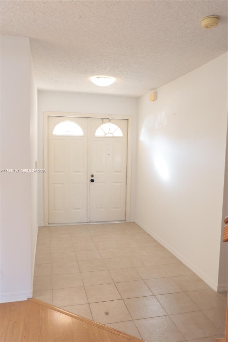 10889 Southwest 149th Place Miami, FL 33196 - Photo 11 of 51 a view of an empty room