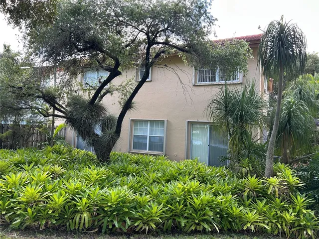 a house with a tree in front of it