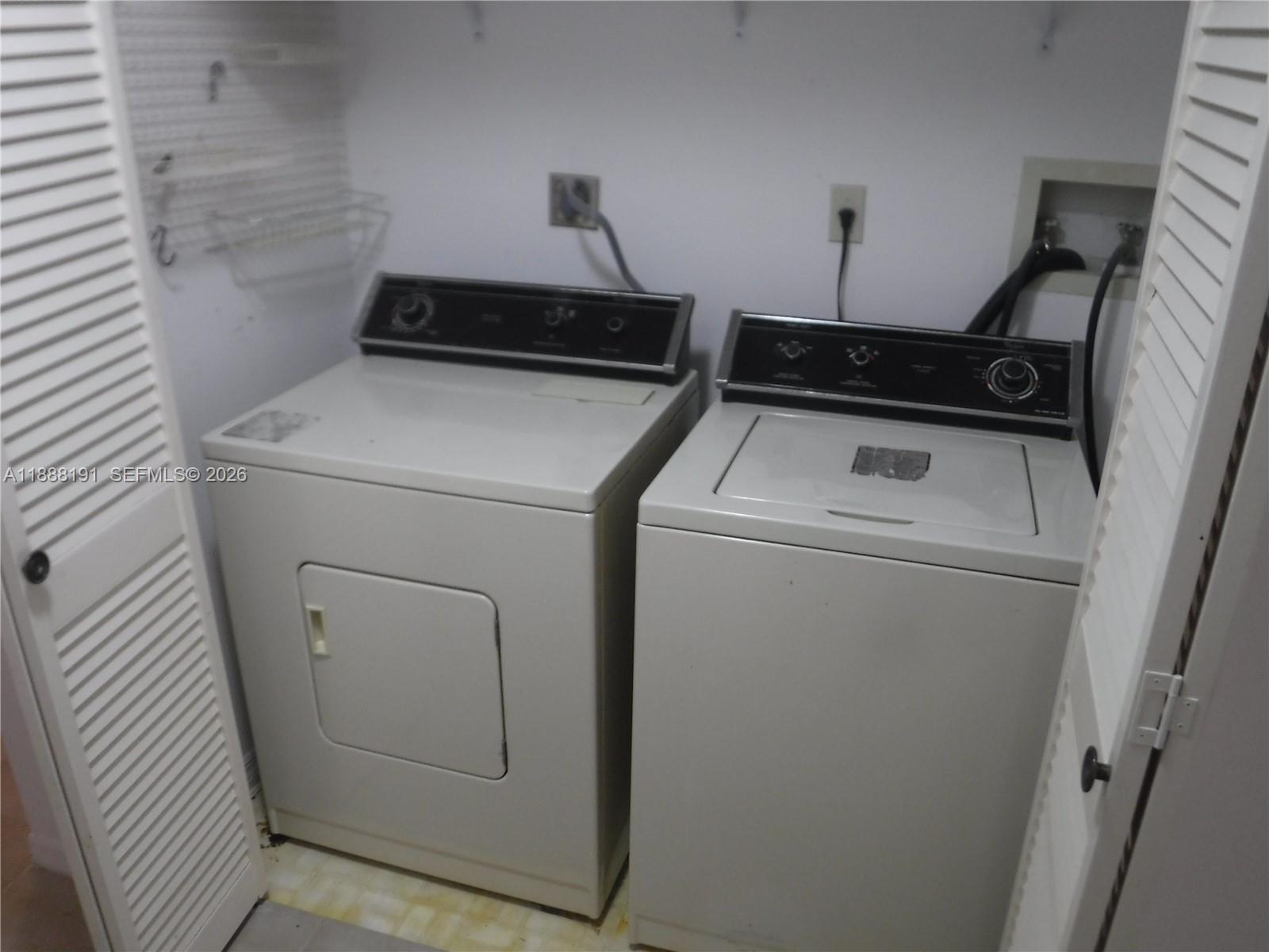 10889 Southwest 149th Place Miami, FL 33196 - Photo 22 of 51 a utility room with dryer and washer