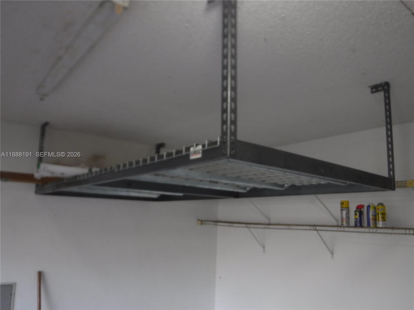 10889 Southwest 149th Place Miami, FL 33196 - Photo 24 of 51 a kitchen with a sink and cabinets