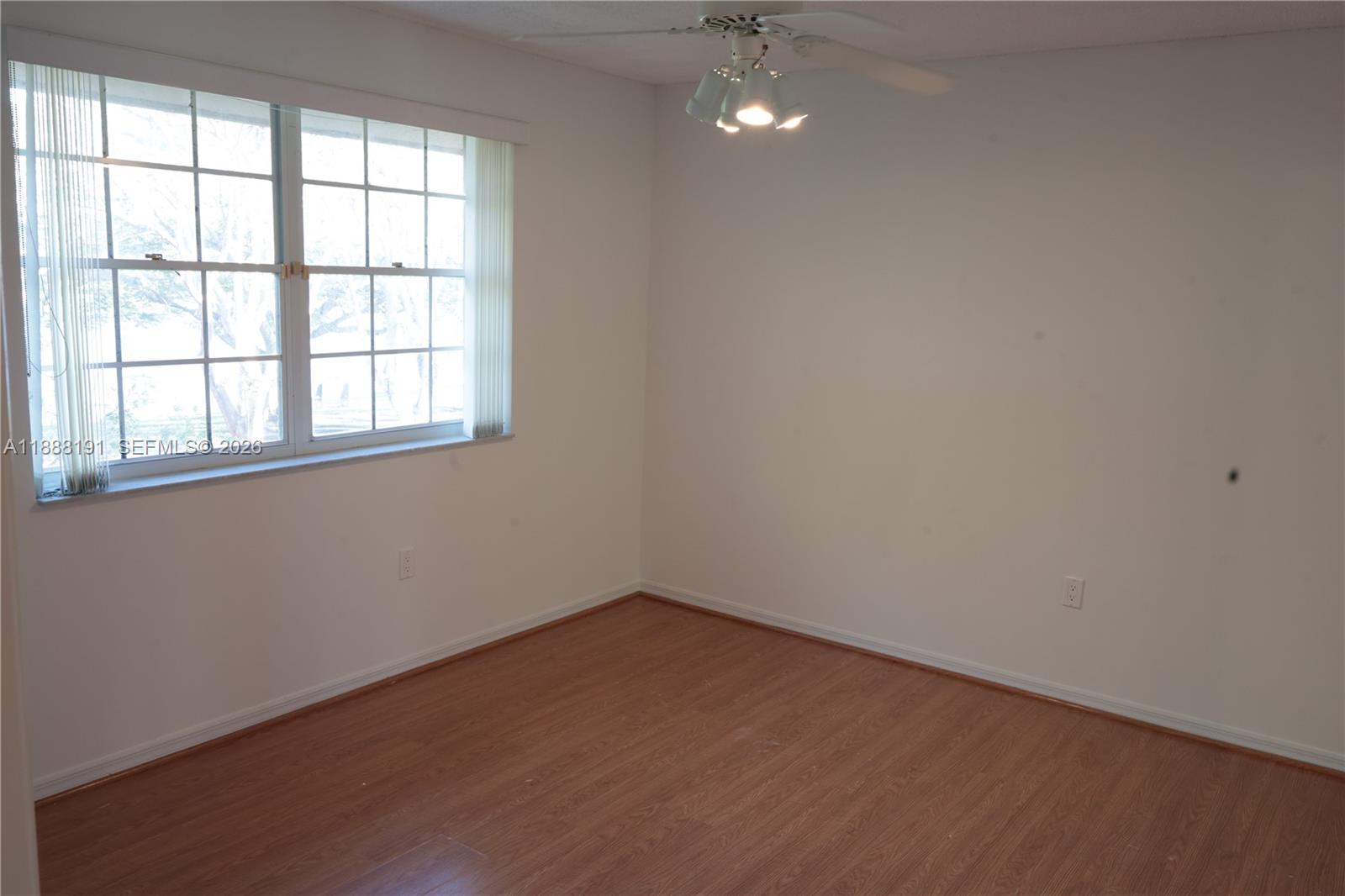 10889 Southwest 149th Place Miami, FL 33196 - Photo 31 of 51 an empty room with a window