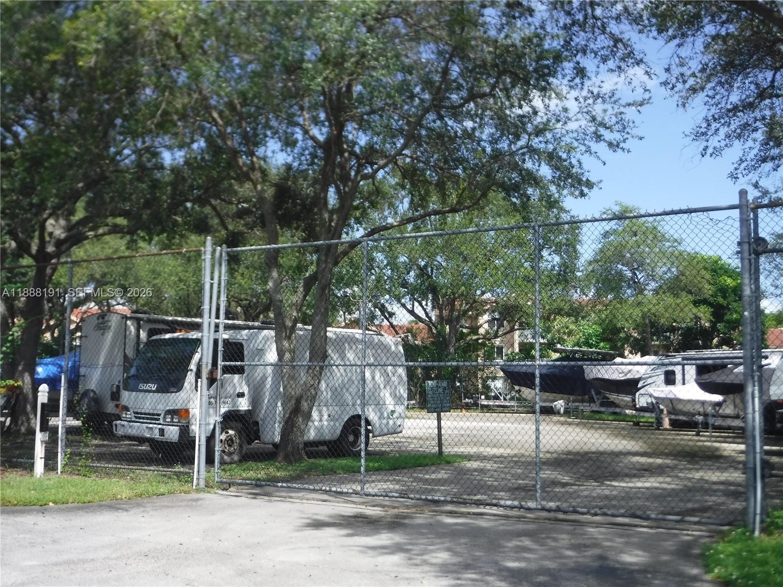 10889 Southwest 149th Place Miami, FL 33196 - Photo 44 of 51 a backyard of a house with lots of green space and fountain