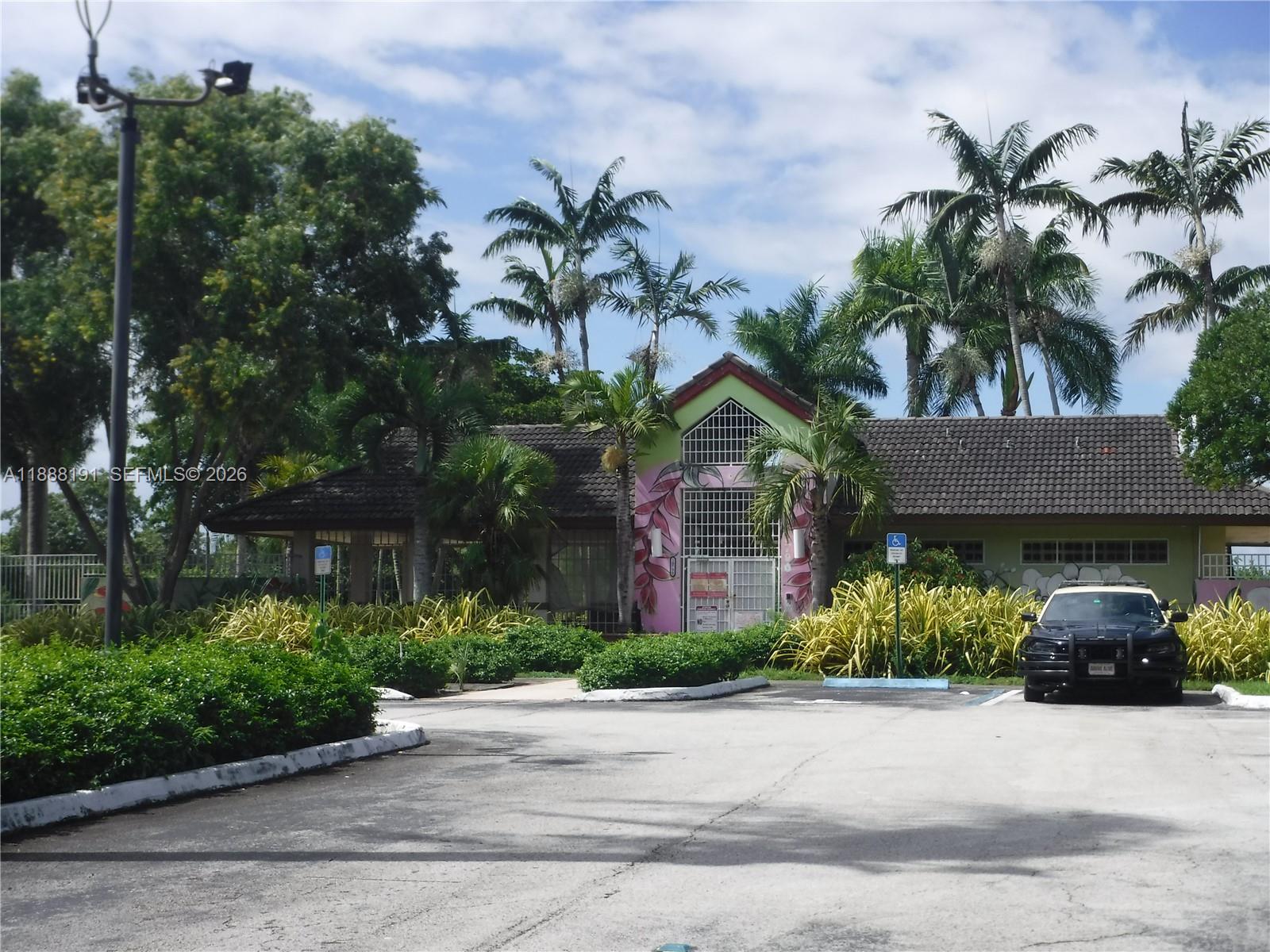 10889 Southwest 149th Place Miami, FL 33196 - Photo 45 of 51 a front view of a house with garden