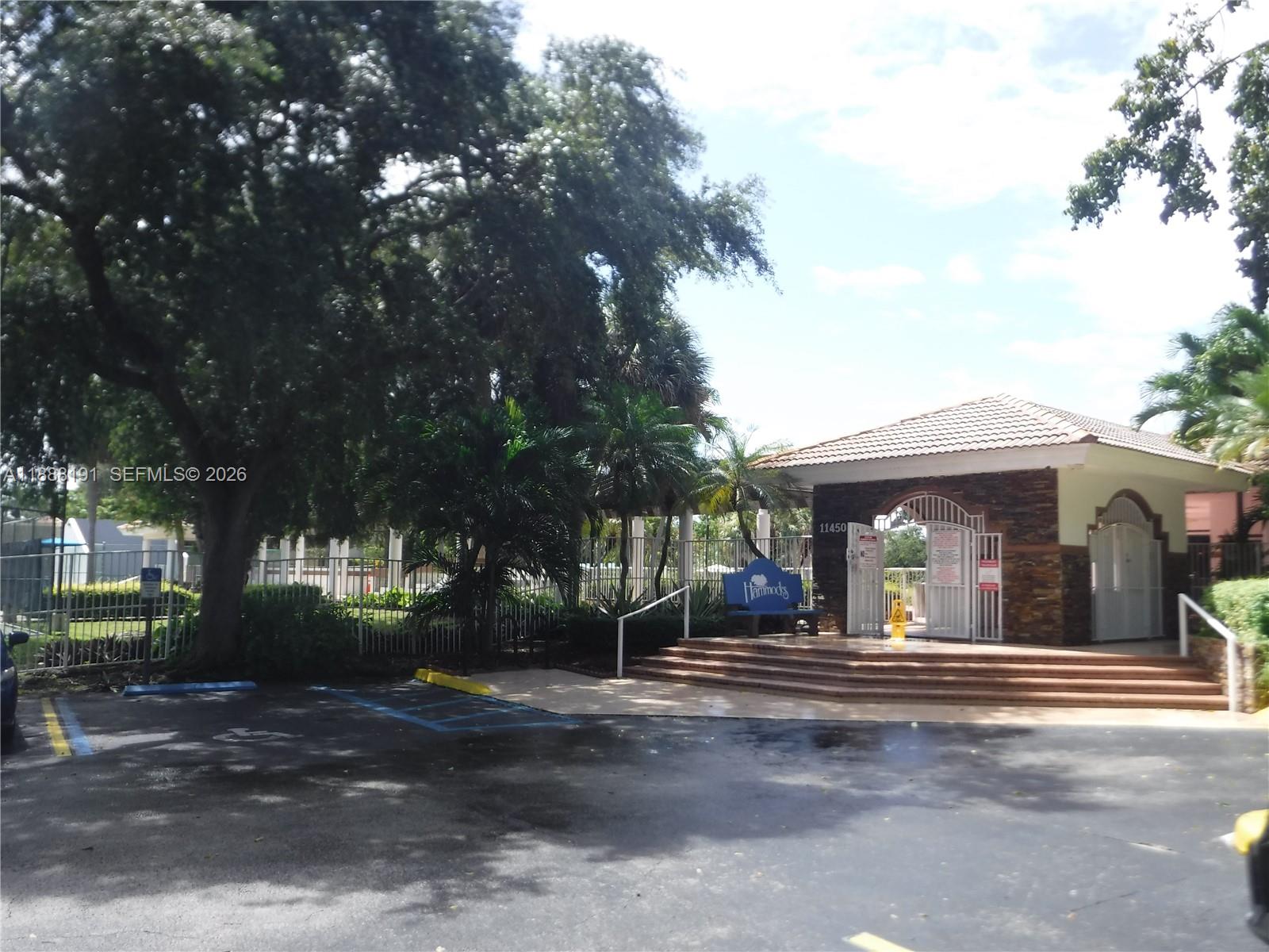 10889 Southwest 149th Place Miami, FL 33196 - Photo 46 of 51 a front view of a house with a yard