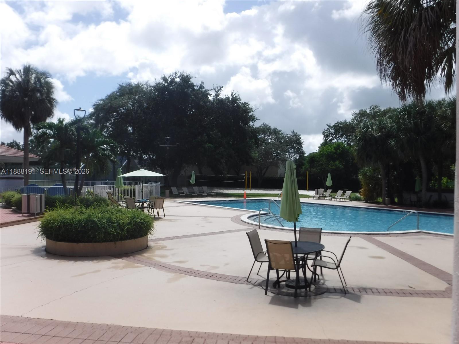 10889 Southwest 149th Place Miami, FL 33196 - Photo 49 of 51 a view of a patio with a table and a chairs