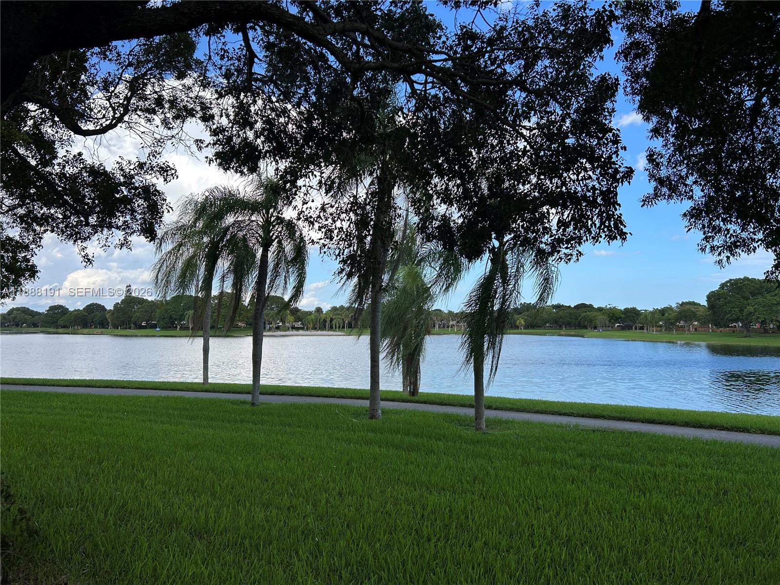 10889 Southwest 149th Place Miami, FL 33196 - Photo 7 of 51 a view of lake with green field