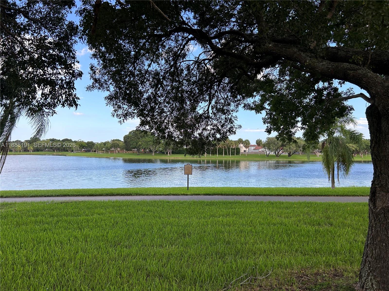 10889 Southwest 149th Place Miami, FL 33196 - Photo 9 of 51 View of Lake/Green Area