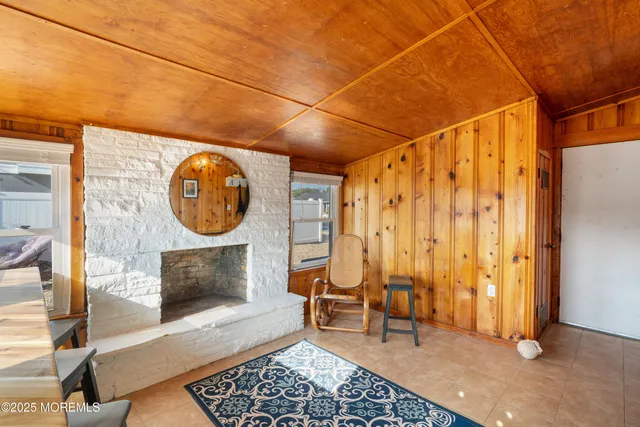a view of a livingroom with furniture and a fireplace
