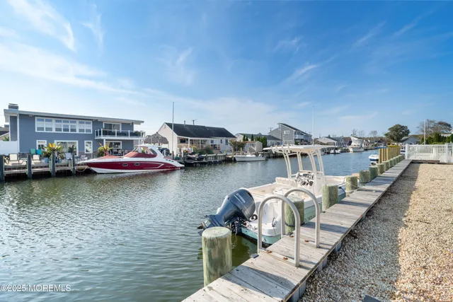 a view of a lake with boats and trees in the background