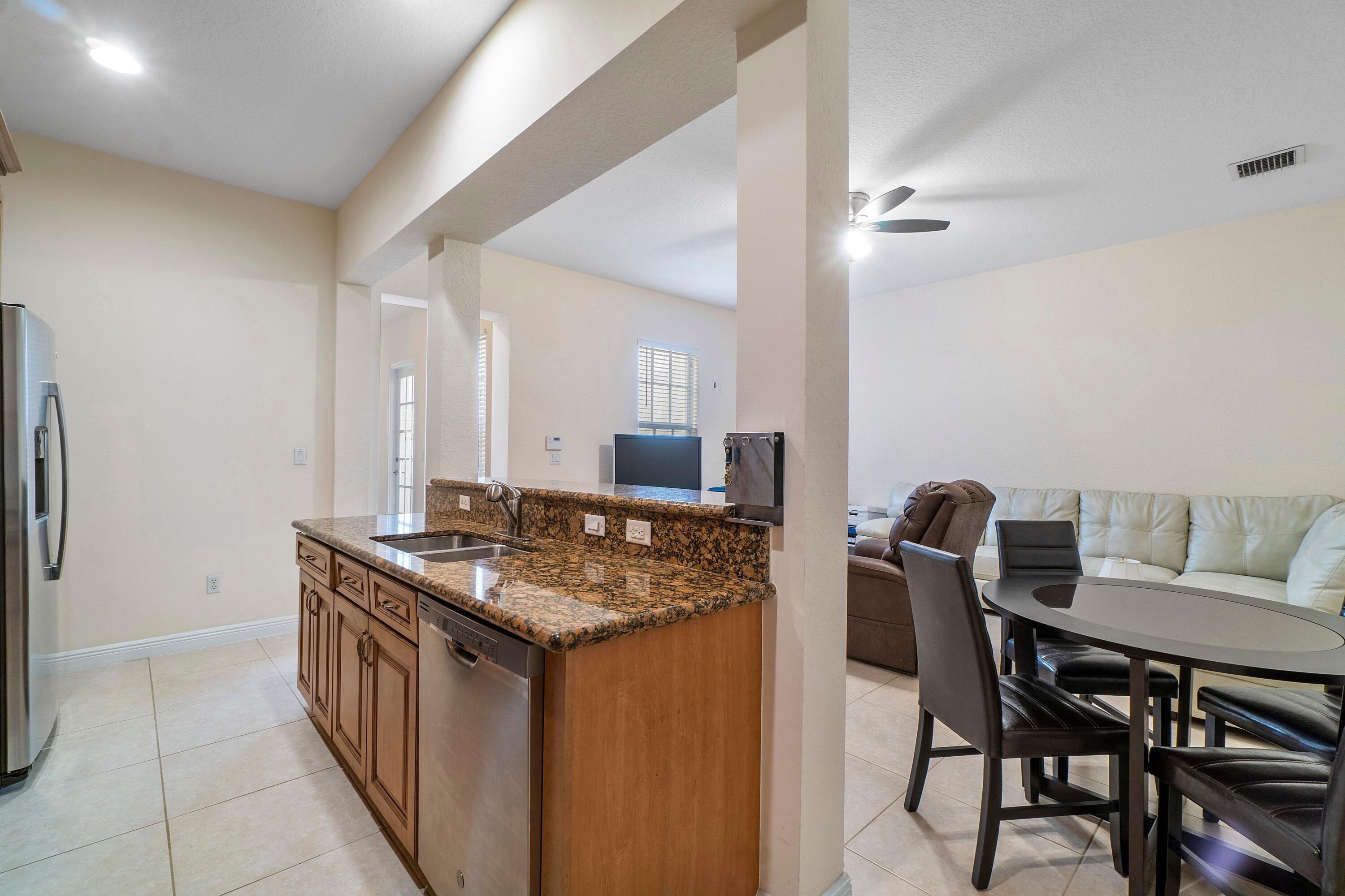 8332 Northwest 7th Court Boca Raton, FL 33487 - Photo 9 of 23 Kitchen & Fam Room