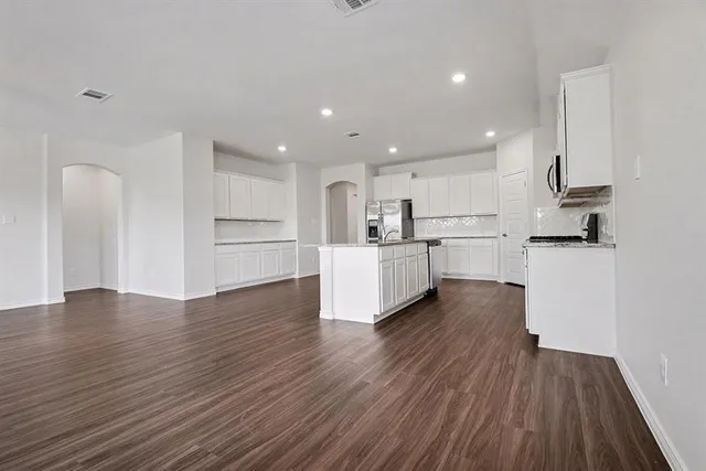 a view of kitchen with wooden floor