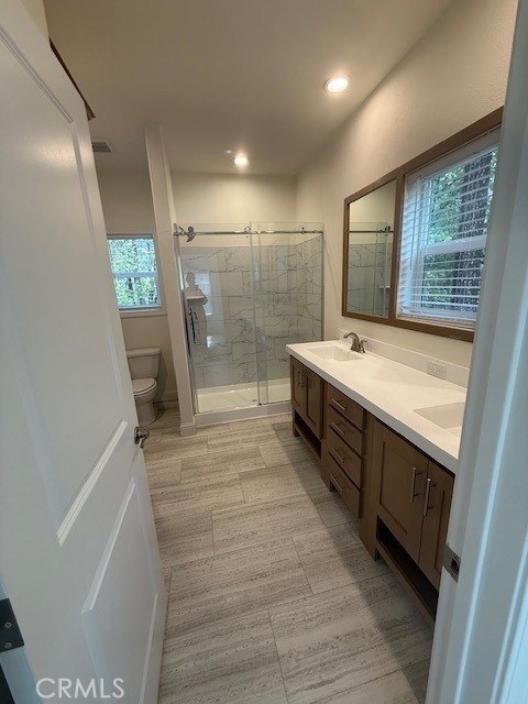 1281 Pleasant Valley Road, Unit 43 Diamond Springs, CA 95619 - Photo 11 of 14 a bathroom with a sink a toilet and a shower
