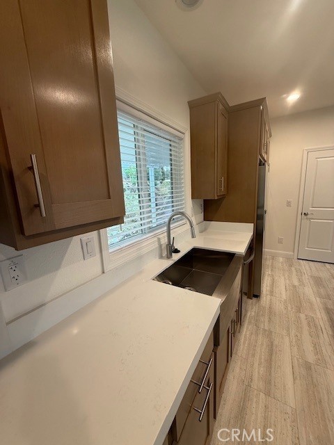 1281 Pleasant Valley Road, Unit 43 Diamond Springs, CA 95619 - Photo 5 of 14 a kitchen with a stove a sink and a microwave