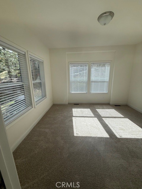 1281 Pleasant Valley Road, Unit 43 Diamond Springs, CA 95619 - Photo 9 of 14 an empty room with windows