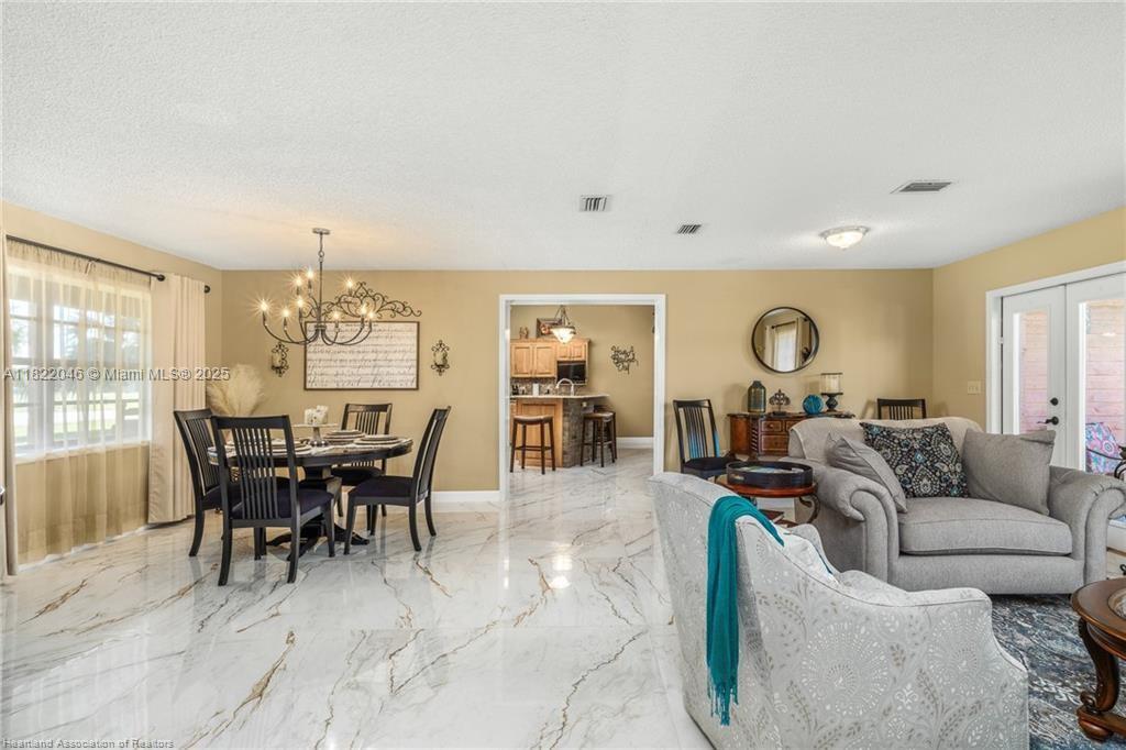 479 E Street Zolfo Springs, FL 33890 - Photo 13 of 50 a living room with furniture and a large window
