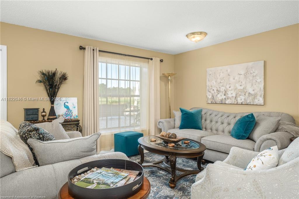 479 E Street Zolfo Springs, FL 33890 - Photo 15 of 50 a living room with furniture and a large window