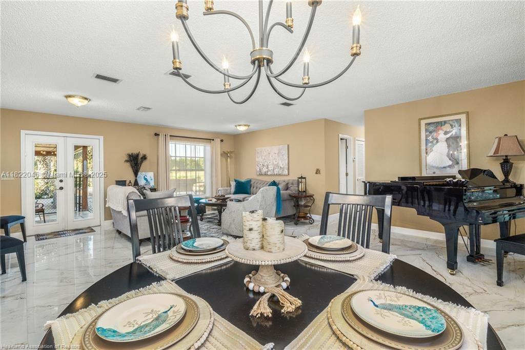 479 E Street Zolfo Springs, FL 33890 - Photo 18 of 50 a living room with furniture and a dining table