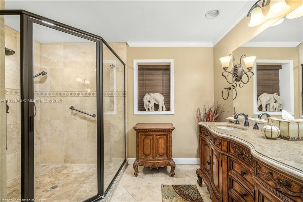 479 E Street Zolfo Springs, FL 33890 - Photo 19 of 50 a bathroom with a sink a mirror and a shower