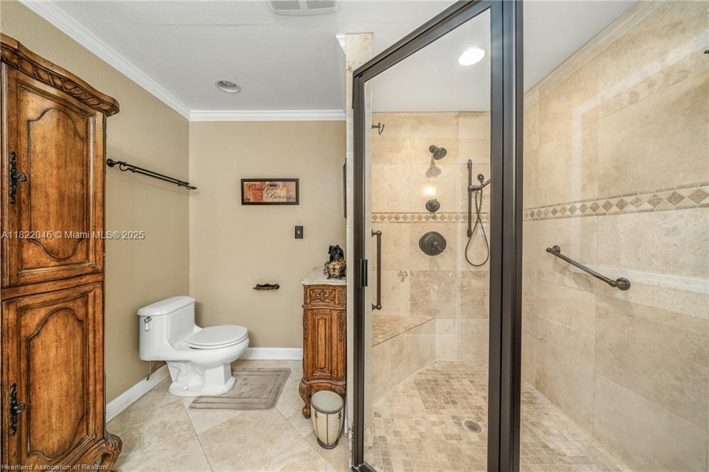 479 E Street Zolfo Springs, FL 33890 - Photo 22 of 50 a bathroom with a toilet shower vanity and a sink
