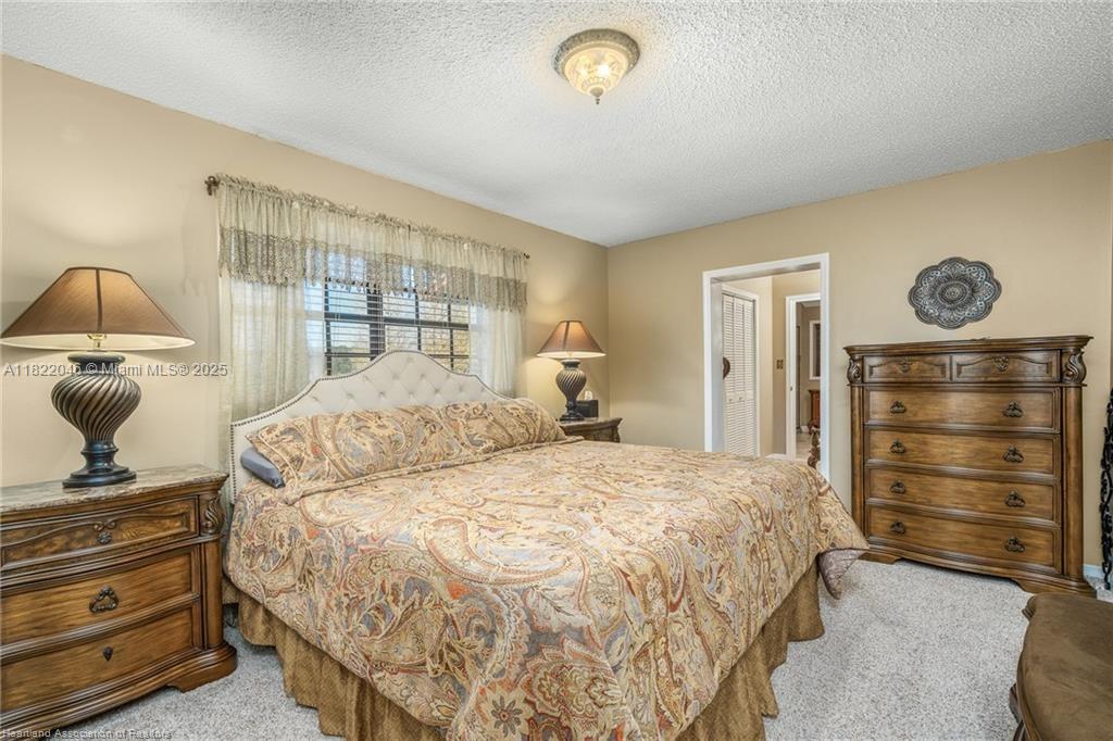 479 E Street Zolfo Springs, FL 33890 - Photo 24 of 50 a bedroom with a bed and a window