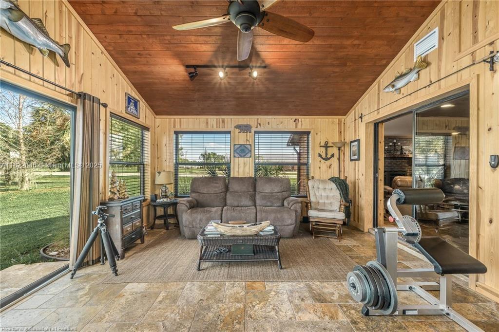 479 E Street Zolfo Springs, FL 33890 - Photo 30 of 50 a living room with patio furniture and a floor to ceiling window