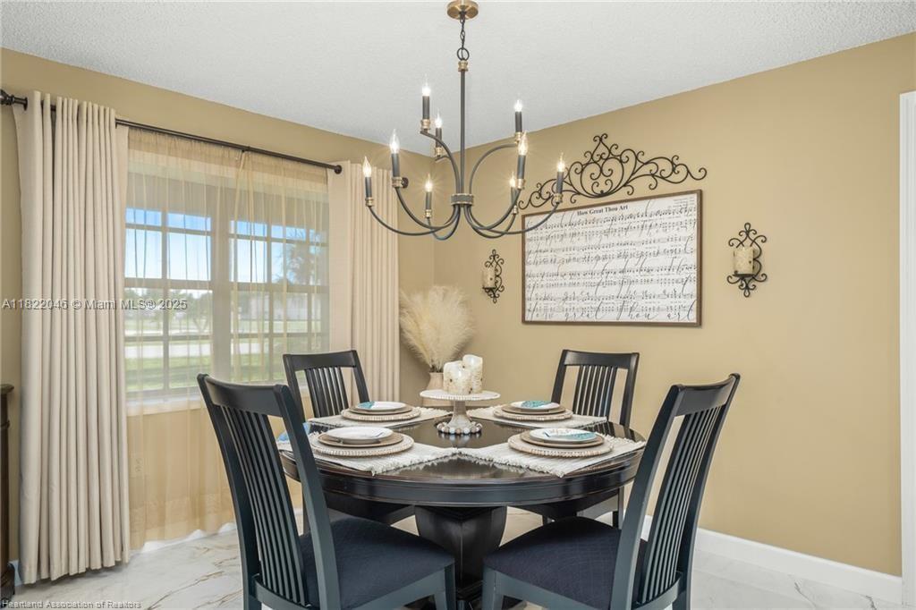 479 E Street Zolfo Springs, FL 33890 - Photo 3 of 50 a view of a dining room with furniture window and outside view