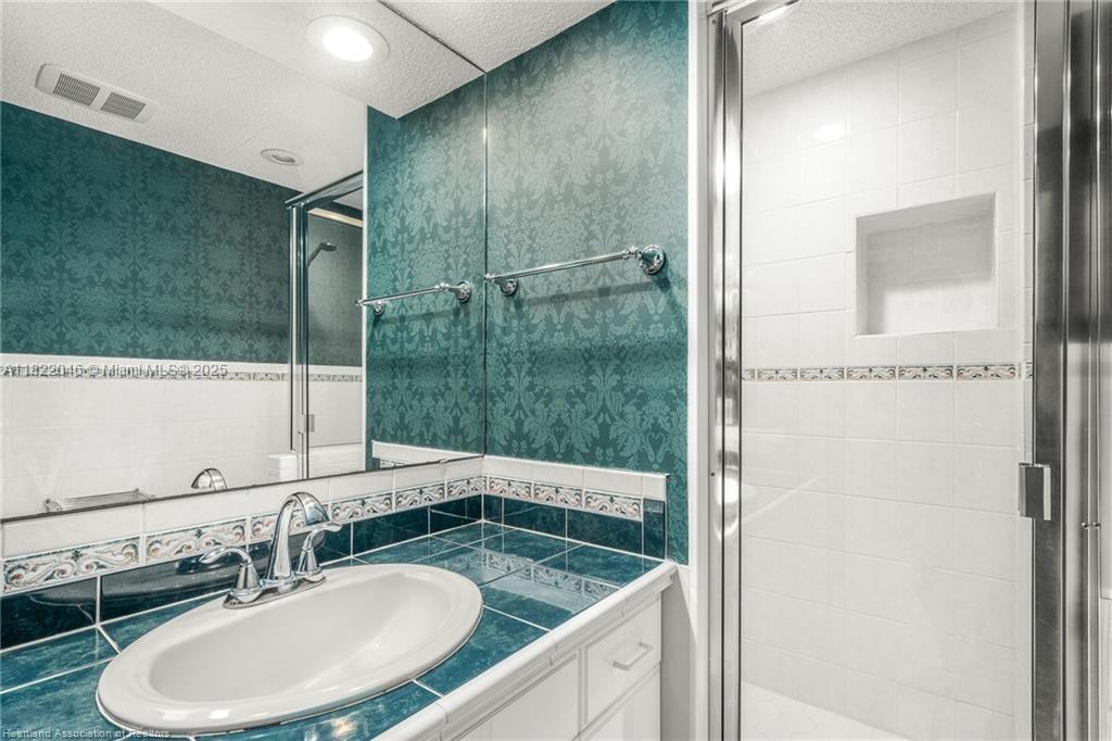 479 E Street Zolfo Springs, FL 33890 - Photo 33 of 50 a bathroom with a sink and a mirror