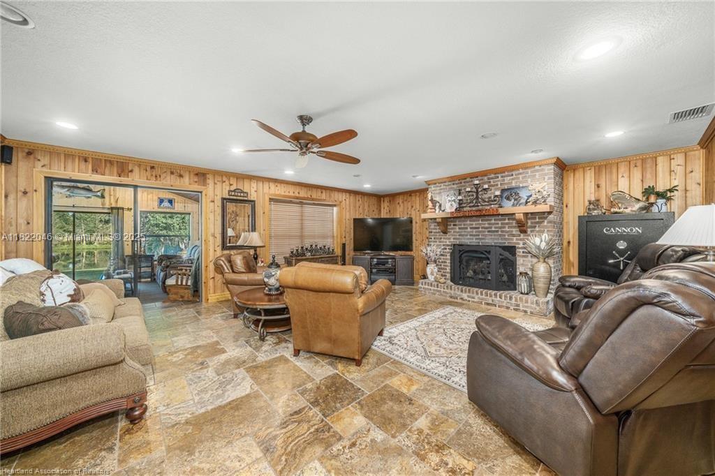 479 E Street Zolfo Springs, FL 33890 - Photo 4 of 50 a living room with furniture fireplace and a large window