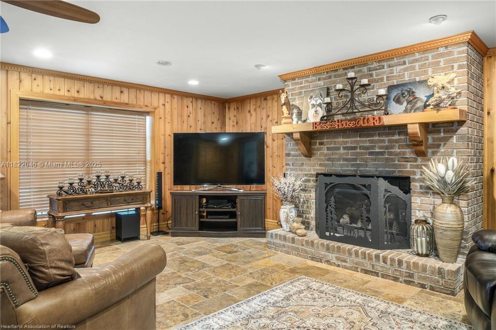 479 E Street Zolfo Springs, FL 33890 - Photo 5 of 50 a living room with furniture a flat screen tv and a fireplace