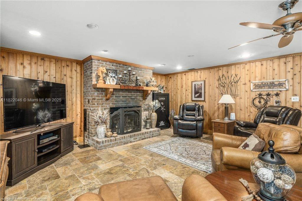 479 E Street Zolfo Springs, FL 33890 - Photo 7 of 50 a living room with furniture a flat screen tv and a fireplace