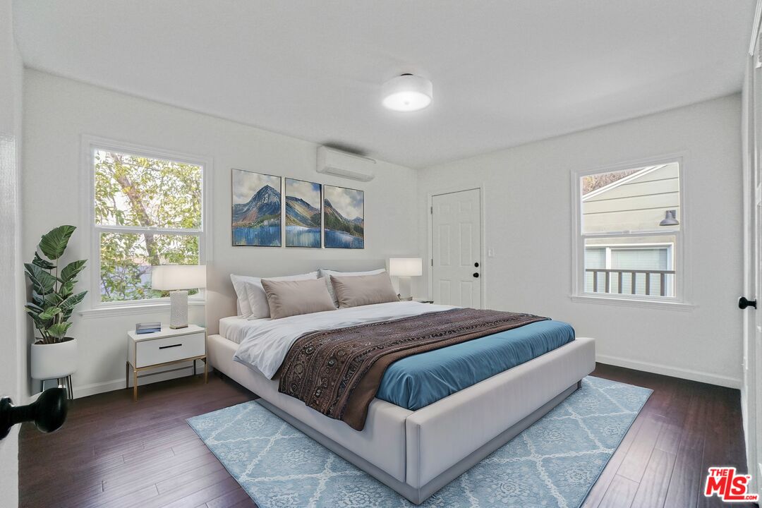 5442 Ebey Avenue Los Angeles, CA 90042 - Photo 18 of 40 a spacious bedroom with a bed and a window