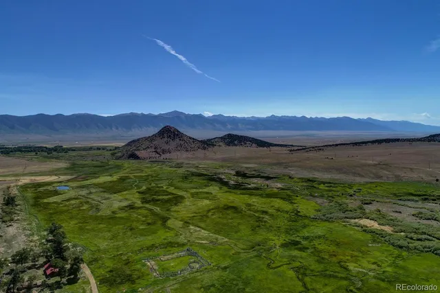 a view of a dry yard and mountain