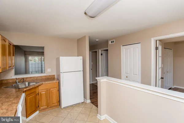 a room with a refrigerator and washer