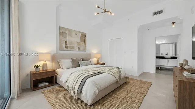 a bedroom with a bed and a couch