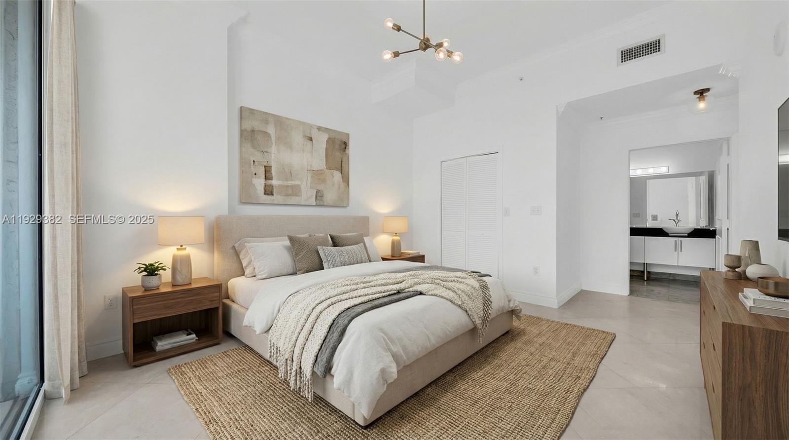 31 Southeast 5th Street, Unit 4314 Miami, FL 33131 - Photo 11 of 40 a bedroom with a bed and a couch