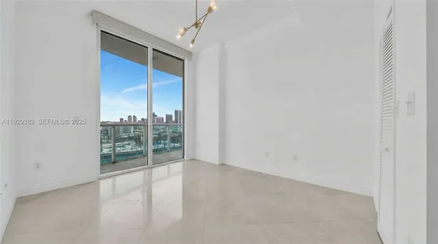 an empty room with glass door