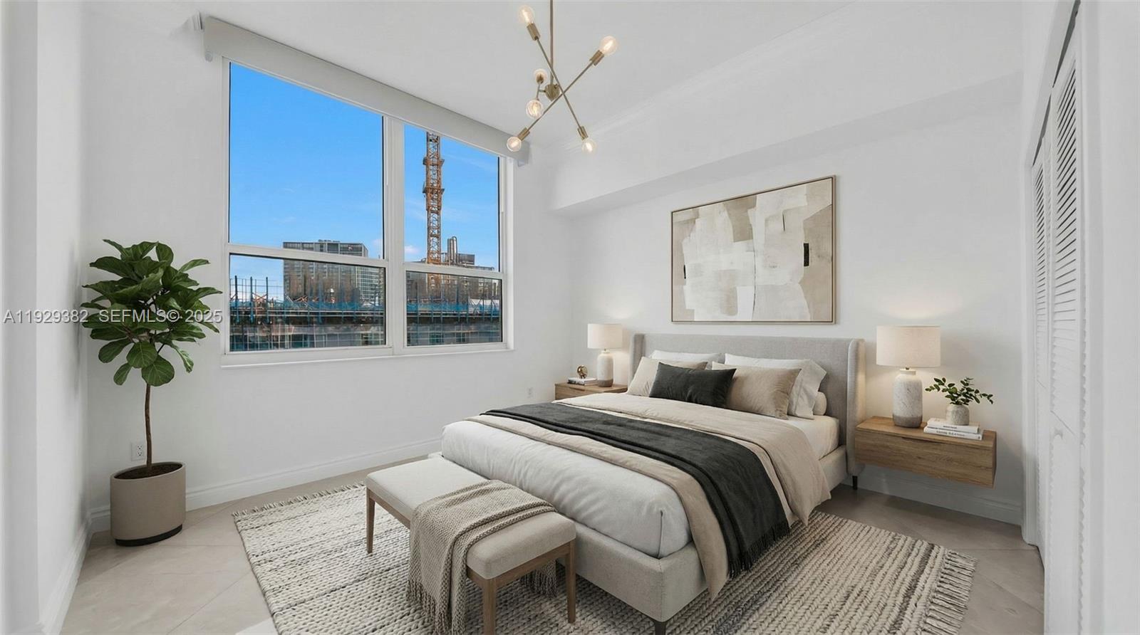 31 Southeast 5th Street, Unit 4314 Miami, FL 33131 - Photo 18 of 40 a bedroom with a bed and a potted plant