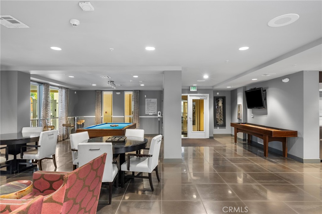 21301 Erwin Street, Unit 206 Woodland Hills, CA 91367 - Photo 23 of 34 a lobby with furniture and large windows