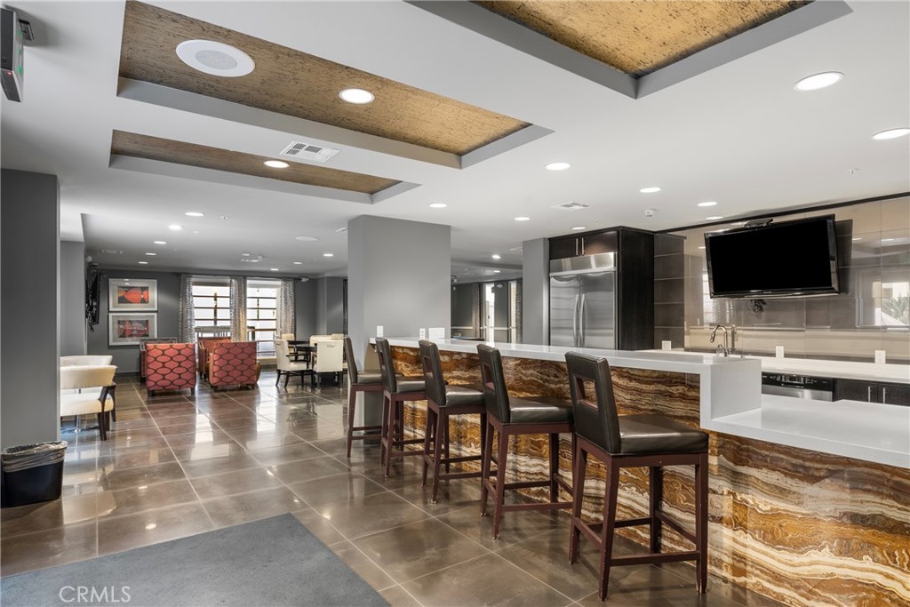 21301 Erwin Street, Unit 206 Woodland Hills, CA 91367 - Photo 24 of 34 a view of a dining area with furniture