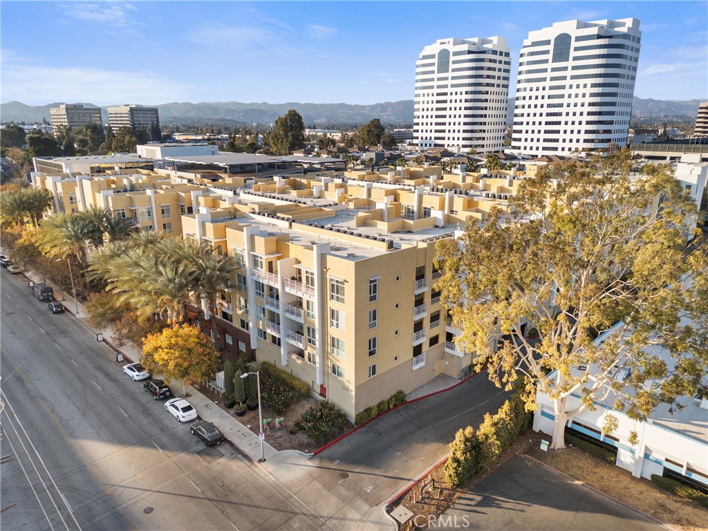 21301 Erwin Street, Unit 206 Woodland Hills, CA 91367 - Photo 32 of 34 a view of a city with tall buildings