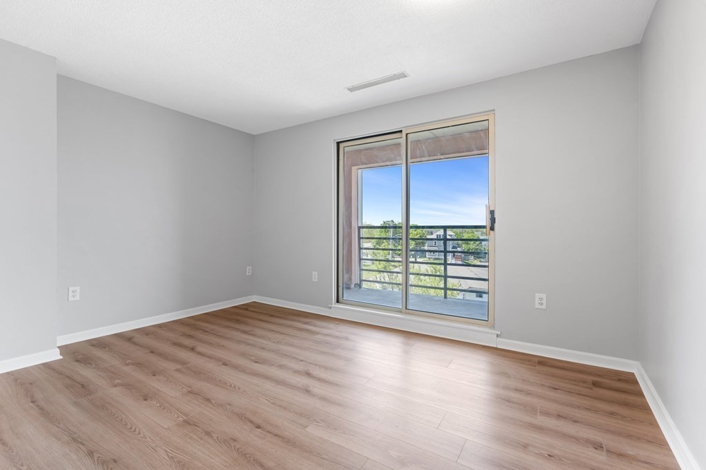 20 Rockland House Road, Unit 402 Hull, MA 02045 - Photo 15 of 40 wooden floor in an empty room with a window