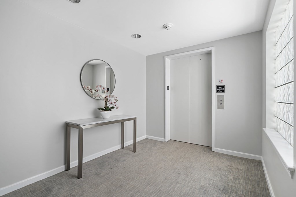 20 Rockland House Road, Unit 402 Hull, MA 02045 - Photo 31 of 40 a view of a livingroom with wooden floor and a window