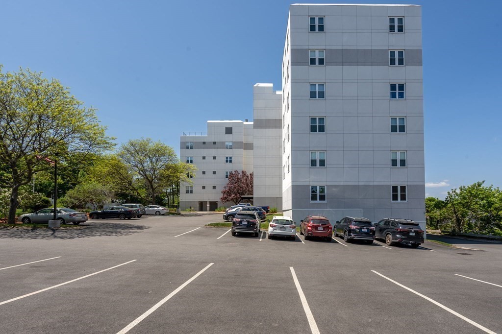 20 Rockland House Road, Unit 402 Hull, MA 02045 - Photo 33 of 40 a car parked in front of a building