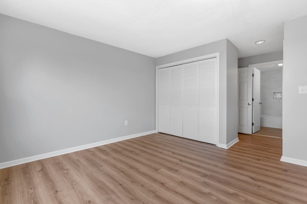 20 Rockland House Road, Unit 402 Hull, MA 02045 - Photo 8 of 40 a view of an empty room with wooden floor